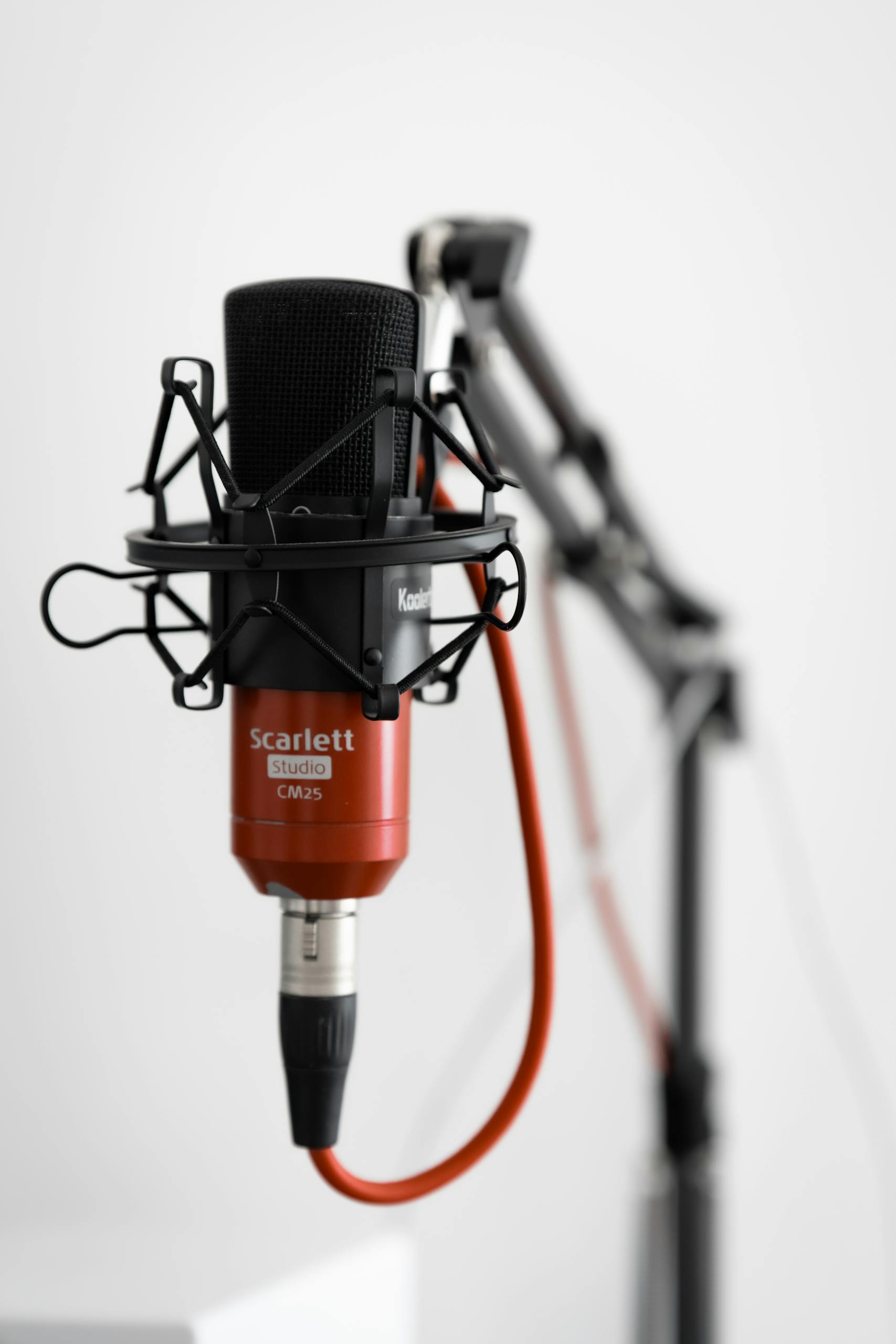 Condenser microphone on a desk arm stand