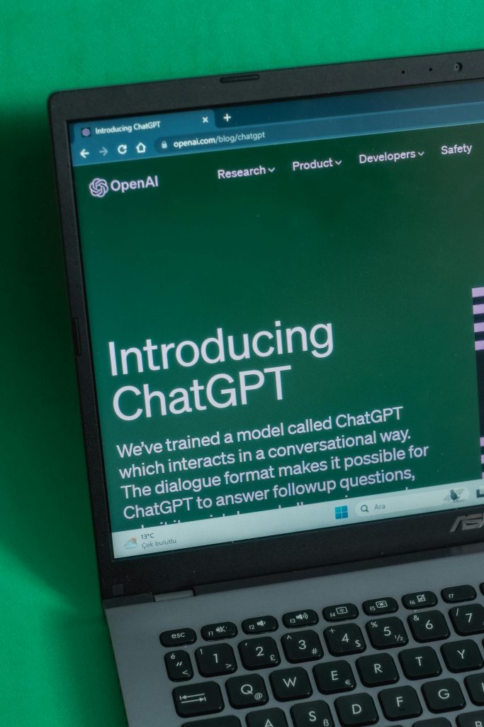 Laptop displaying ChatGPT introduction page on a web browser.
